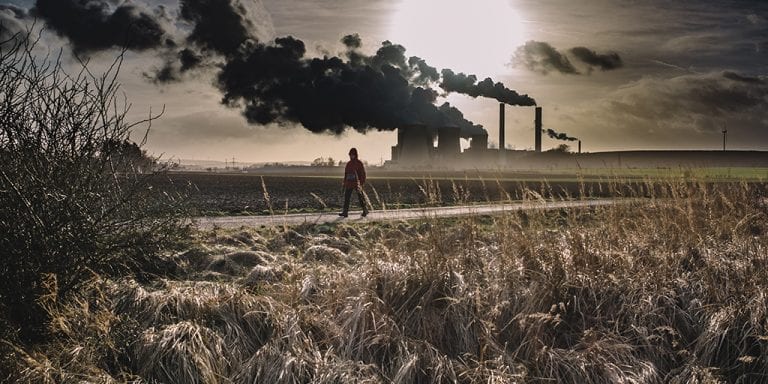 Stroller with power plant in background